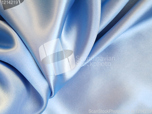 Image of Smooth elegant blue silk as background 