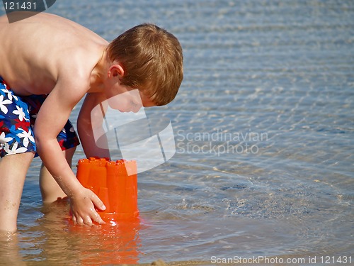 Image of boy playing at beach