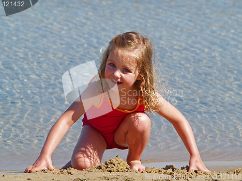 Image of girl playing in sand