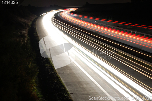 Image of highway at night with traffic