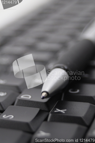 Image of pen and keyboard