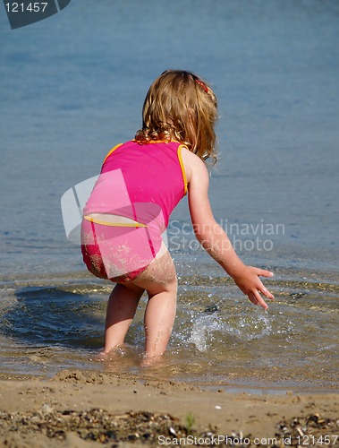 Image of girl splashing at beach