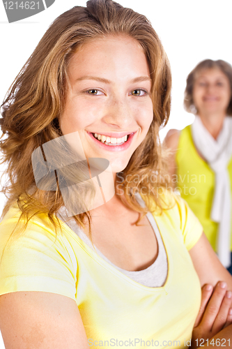 Image of Gorgeous woman in focus with her mom in the background