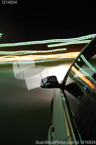 Image of night drive with car in motion 