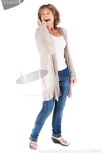 Image of Senior woman pointing upwards and looking away