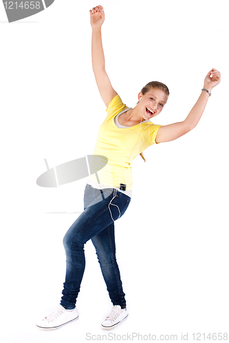 Image of Happy teen enjoying music and dancing