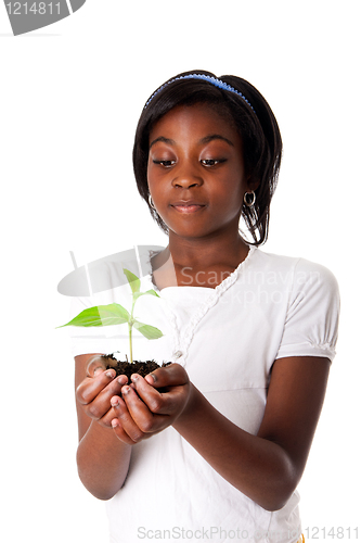 Image of Girl with plant in hand