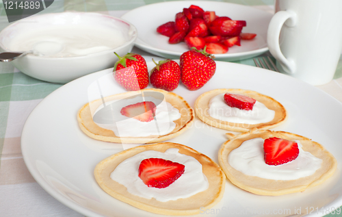 Image of Flapjacks With Strawberries and Cream