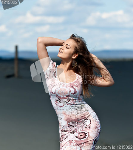 Image of beautiful girl in a stylish dress