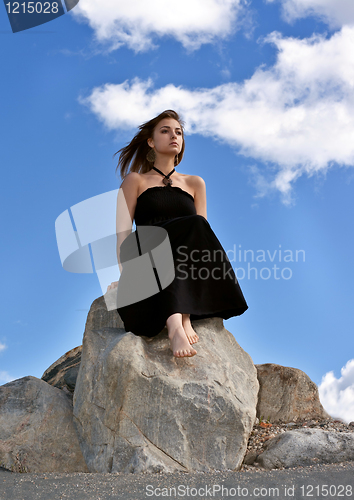 Image of beautiful girl in a black dress