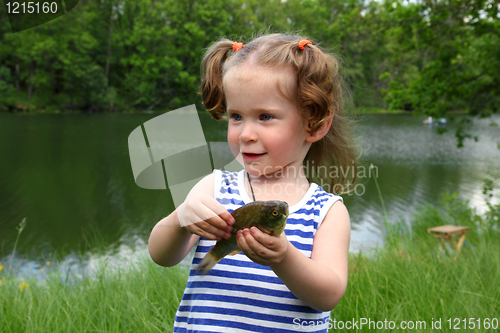 Image of fishing - littlle girl with catching fish
