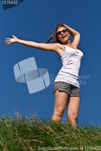 Image of girl in sunglasses and a white dress