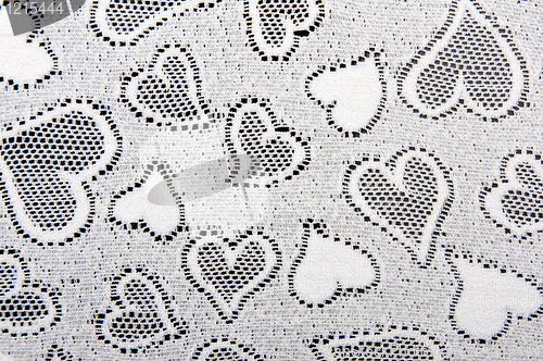 Image of white lace patterned with hearts