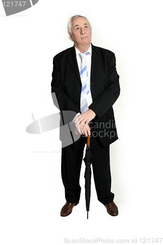 Image of senior standing with umbrella