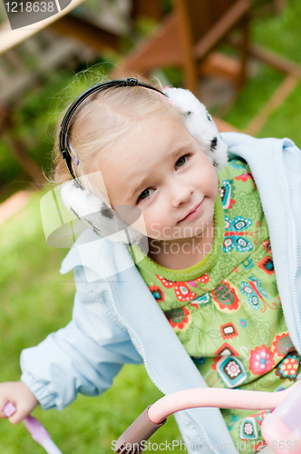 Image of Little girl playing outside