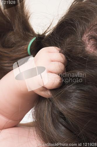 Image of baby grabbing hair