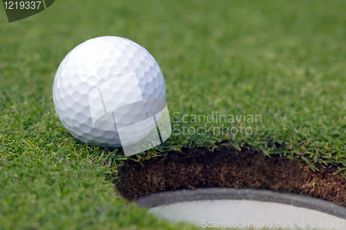 Image of Golfball almost in the hole 