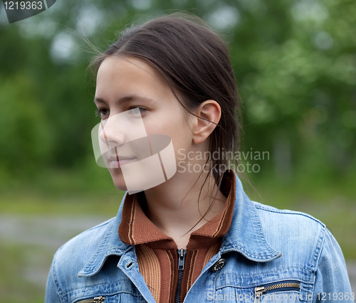 Image of A girl in a denim jacket