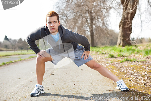 Image of Mixed race man stretching