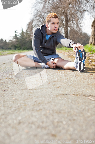 Image of Mixed race man stretching