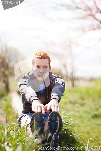 Image of Mixed race man stretching