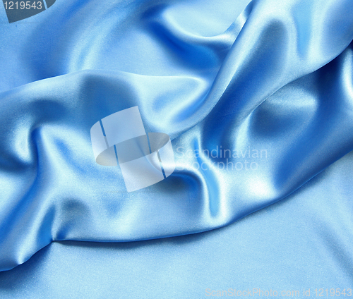 Image of Smooth elegant blue silk as background 