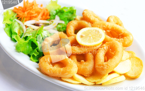 Image of Deep batter fried squid rings calamari with green salad 