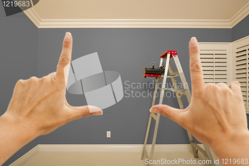 Image of Hands Framing Grey Painted Wall Interior