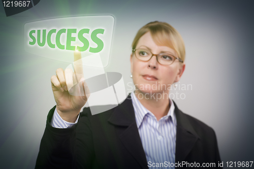 Image of Woman Pushing Success Button on Interactive Touch Screen