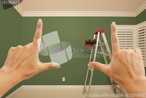 Image of Hands Framing Green Painted Wall Interior
