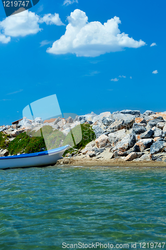 Image of beach with stones and boats