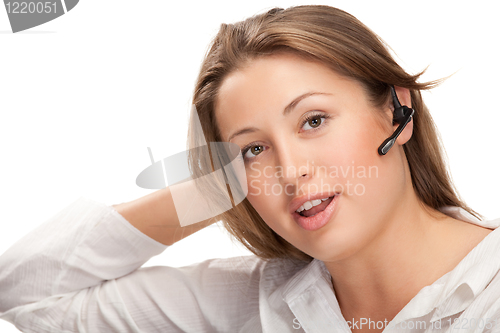 Image of young beautiful business woman with headsetling