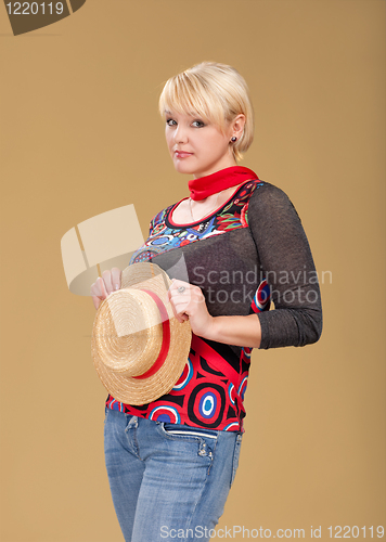 Image of blond woman and straw bonnet