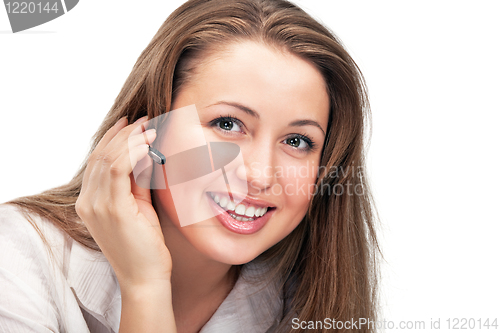 Image of young beautiful business woman with headsetling