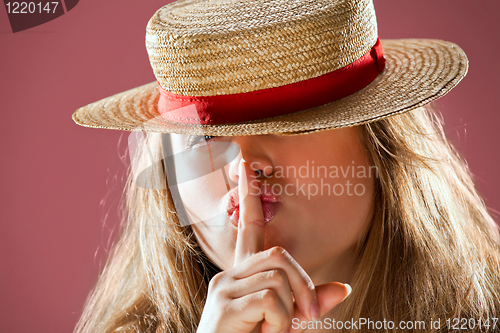 Image of blond woman and straw bonnet