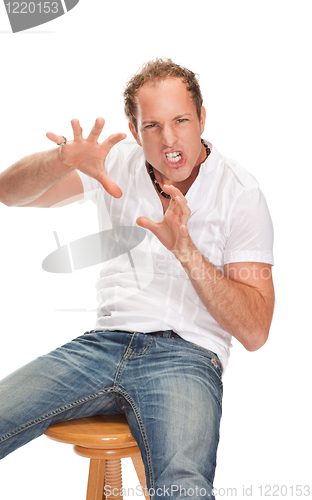 Image of Portrait of young surprised man gesturing.