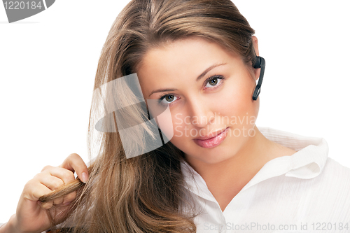 Image of young beautiful business woman with headsetling