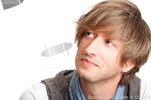 Image of Portrait of young surprised man gesturing.