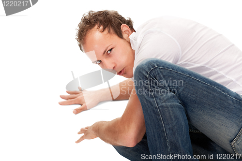 Image of Portrait of young surprised man gesturing.