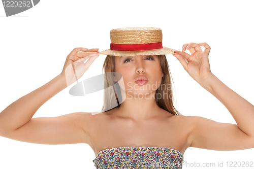 Image of blond woman and straw bonnet