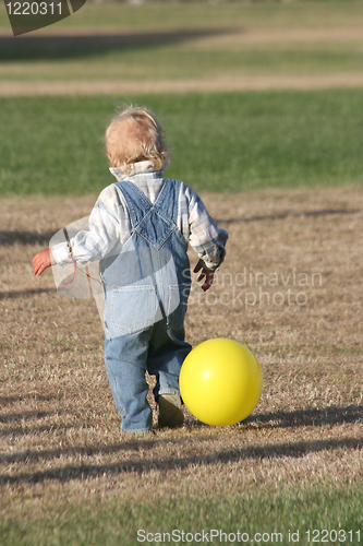 Image of boy with yellow balloon