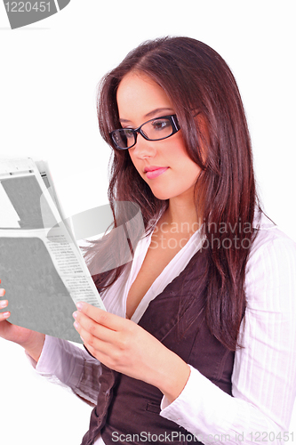 Image of beautiful brunette reading the morning paper