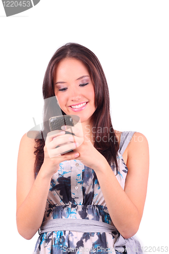 Image of Young girl chatting on a cell phone 