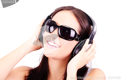 Image of  woman with headphones listening to music 