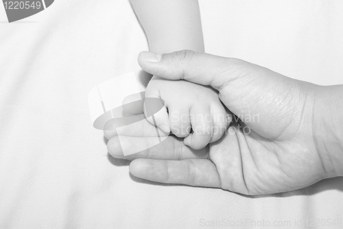 Image of Father holding daughters hand 