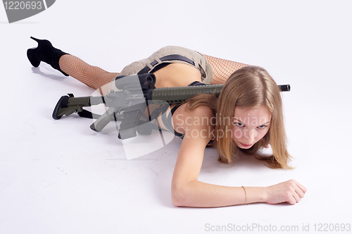 Image of Pretty woman with rifle