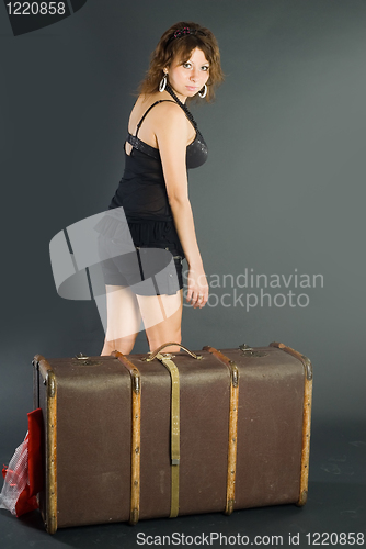 Image of Beautiful girl with suitcase