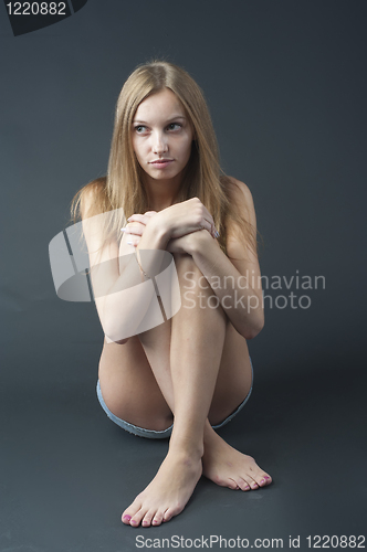 Image of Sitting pretty girl
