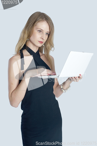 Image of Attractive blonde girl with laptop