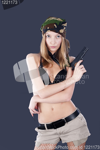 Image of Pretty woman with a gun